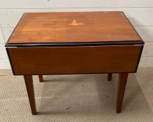 A small inlaid table with drop sides on tapering legs