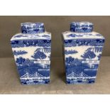 A pair of blue and white ginger jars