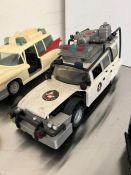 A selection of Ghostbuster cars and motorbikes