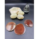 A selection of marble eggs, dish and glass paperweight