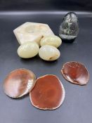 A selection of marble eggs, dish and glass paperweight