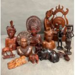 A selection of wooden carved figures and animals