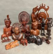 A selection of wooden carved figures and animals
