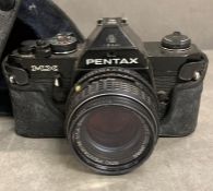 A Pemtax max "point and shoot" camera with a 50mm lens