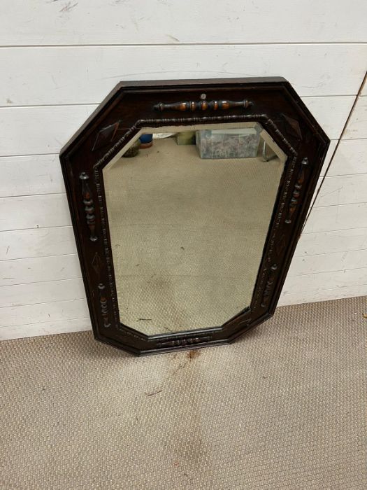 An oak over mantle mirror 109cm x 70cm