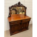 A Victorian chiffonier with mirrored gallery top with carved foliated decoration (H163cm W122cm