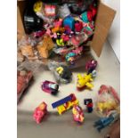 A selection of McDonalds happy meal toys including Simpsons