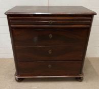 A mahogany bachelors chest of drawers on bun feet (H93cm W92cm D35cm)