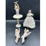 A selection of porcelain figures to include Royal Worcester