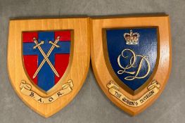 Two military wooden plaques to include the queens division and B.A.O.R