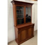 A mahogany glazed bookcase with cupboard under (H215cm W120cm D48cm)