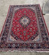 A Persian Keshaun red rug 370cm x 242cm