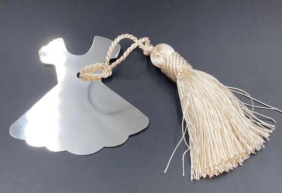 A White metal dress bookmark with silk tassel