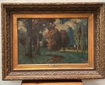 An oil on canvas of a woodland scenery signed right corner E. Rudishuli