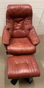 A Leather stress less style recliner chair and stool