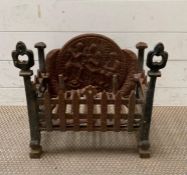 A fire place grate with original cast iron back