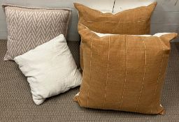 A selection of four cushions various sizes