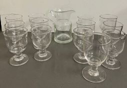 A selection of studio art glass goblets and jug, handblown by Simon Pearce