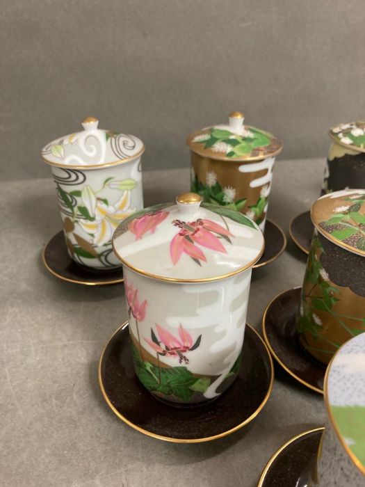 A selection of twelve floral decorated porcelain sake/tea cups and saucers - Image 3 of 5