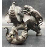 A Japanese bronze of an elephant and two tigers, signed to base.