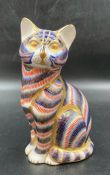 A Royal Crown Derby figure of a cat, with a gold stopper.