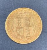 An 1891 Half gold sovereign.