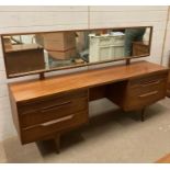 A Mid Century dressing table with full width mirror (63cm x 168cm x 41cm)