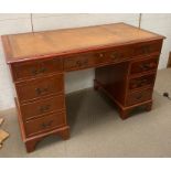 A mahogany leather topped pedestal desk (H76cm W122cm D60cm)