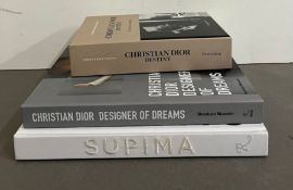 Two hardback reference books on Christian Dior and one Supima
