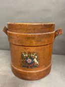 A Leather stick stand with lead lining and crest motif to front H 36cm x D 32cm