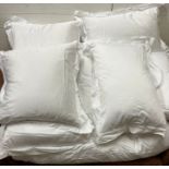 Three square, three rectangular pillows and Superking duvet all with white cotton bed linen.