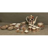 A Royal Crown Derby part tea and coffee service along with a miniature tea service
