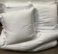 Three square pillows and one empire duvet all with white linen by Heirlooms (New Showhome Dressing)