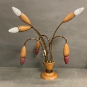 A Mid Century table lamp in a tulip style.