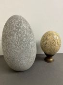 A speckled pattern ostrich egg and egg sculpture