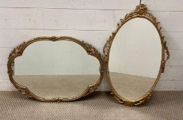 Two gilt framed oval wall mirrors