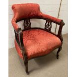 A Victorian style upholstered tub chair on castors