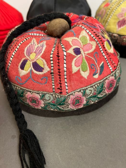 A selection of Nepalese and mandarin embroidered smoking caps. - Image 2 of 5