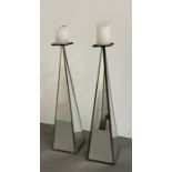 A pair of mirrored candle holders (H46cm)