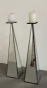 A pair of mirrored candle holders (H46cm)