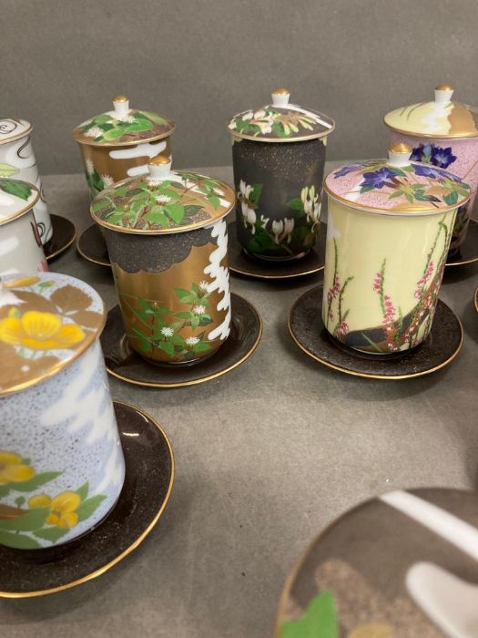 A selection of twelve floral decorated porcelain sake/tea cups and saucers - Image 4 of 5