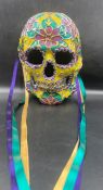 A Venetian Mask in the shape of a skull, signed by artist.