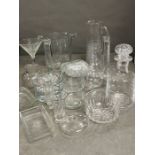 A selection of glassware including crystal glass jugs, ice buckets, decanters and candlestick