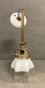 A Victorian brass ceiling light with a two tone glass shade with crimped detailing