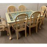 An interesting embellished dining table with six chairs