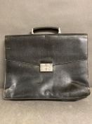 A Prada women's vintage Saffiano business bag in black calf leather.