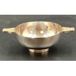 A silver quaich, with Celtic handles and plain finish, engraved. Hallmarked for Sheffield 1990 by