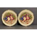 A pair of Aynsley china, cabinet plates with fruit design