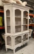 A French Louis style display cabinet in white with wire front and sides (211cm x D 45 cm x W 147cm)