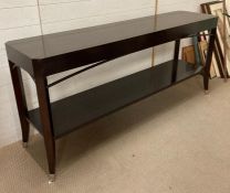 A contemporary console table on out splayed legs ending in chrome caps 81 cm x 45 cm x 180cm